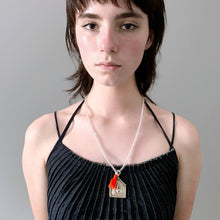 Load image into Gallery viewer, Clear Beaded Old Fashioned Online charm with orange tassel and silver pendant charm on girl wearing pleated top
