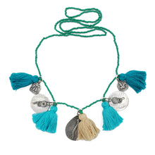 Load image into Gallery viewer, Ethically sourced Old Fashioned Online green beaded necklace with Turquoise tassels and five silver amulet charms necklace on flat lay

