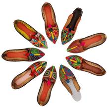 Load image into Gallery viewer, Old Fashioned Online Nine very colourful hand crafted embroidered leather house shoes that are arranged in a circle

