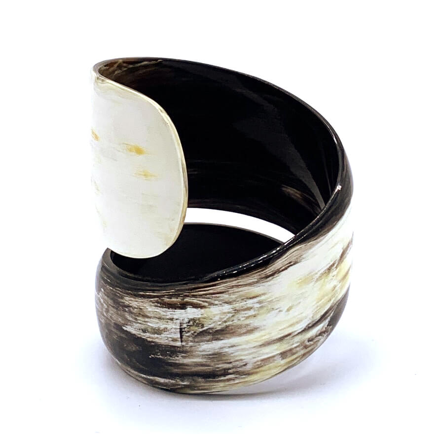 A picture of large lighcoloured  Old Fashioned Online Wide Minimalist polished black white and mushroom spiral Cuff bangle, made from ethically sourced natural horn