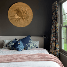 Load image into Gallery viewer, sage grevillea printed on indigo square linen designer cushion with tassels on pink bed in bedroom with chocolate walls and a kookaburra 
