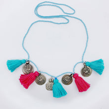 Load image into Gallery viewer, Ethically sourced Old Fashioned Online multi coloured pale blue beaded necklace with turquoise and pink tassels and five silver amulet charms on flat lay
