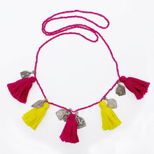 Load image into Gallery viewer, Ethically sourced Old Fashioned Online pink beaded necklace with pink and yellow tassels and five silver amulet charms on flat lay
