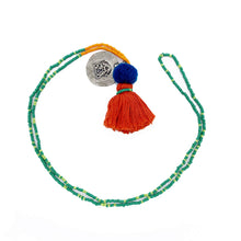 Load image into Gallery viewer, Colorful Old Fashioned Online green and orange beads with tassel, pompom and silver amulet charm in pink and blue on white background
