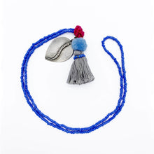 Load image into Gallery viewer, Colorful Old Fashioned Online beads with tassel, pompom and silver amulet charm necklace in pink and blue flat lay
